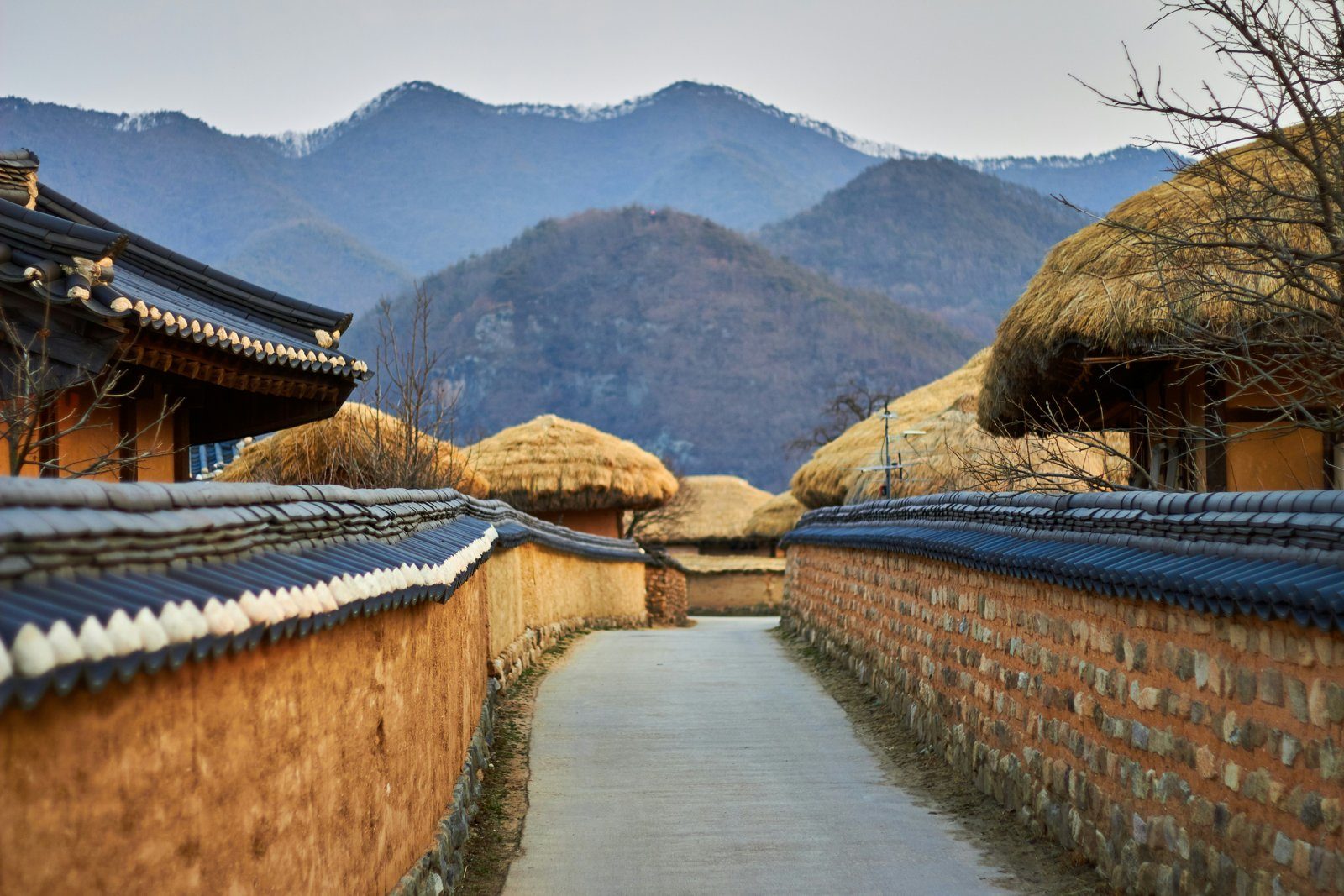 Thatched-roof traditional houses and stone walls of a folk village near Andong