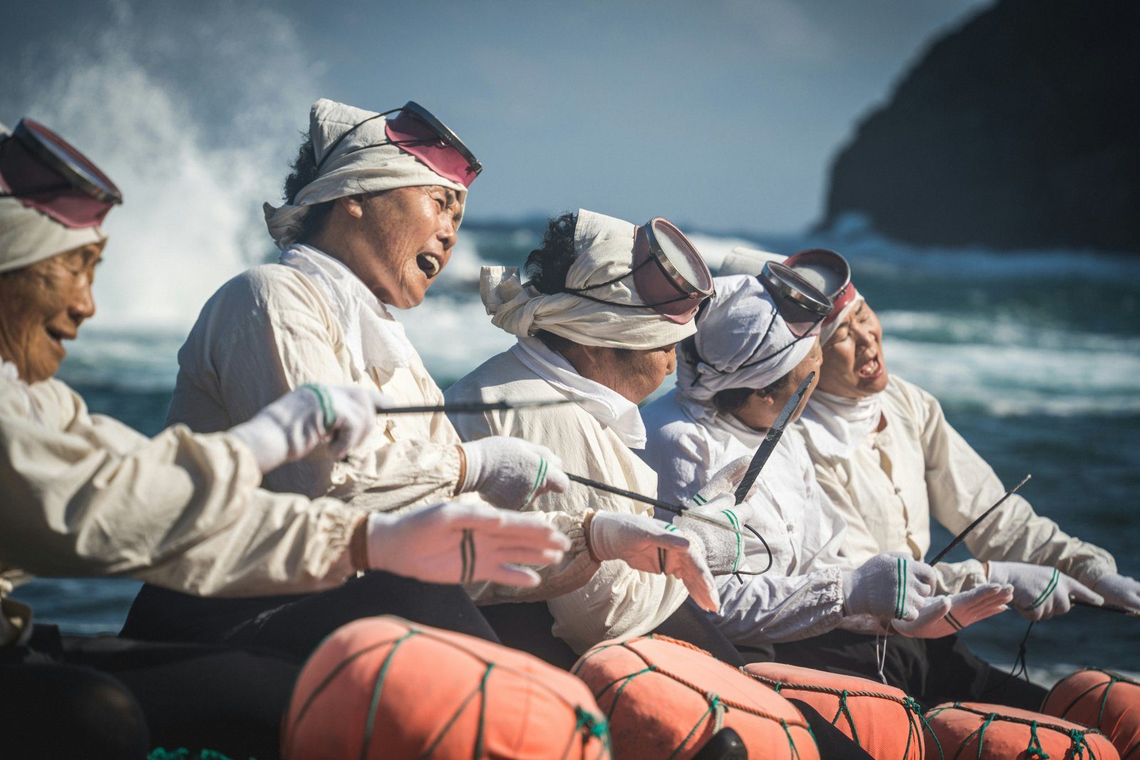 Jeju haenyeo women divers in white by the sea